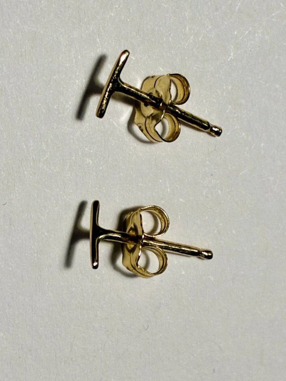 Pair of Catbird "Little Secret" gold stud earrings